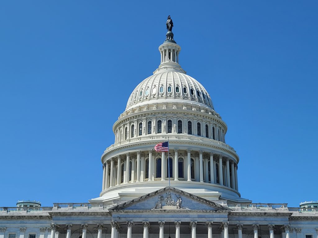 The American flag flies in front of the Capitol Rotunda in Washington, D.C.