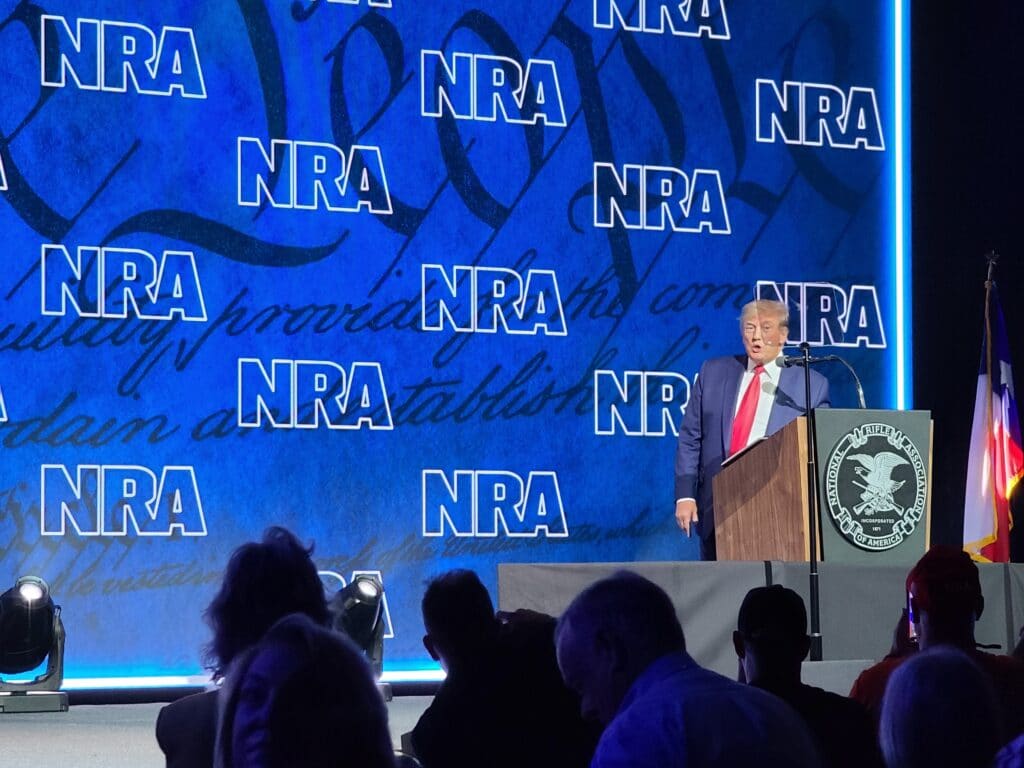 Donald Trump approaches the podium at the 2022 NRA National Meeting