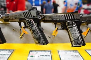 A 1911 with former president Donald Trump's face engraved in it on display at the 2023 NRA Annual Meeting