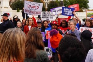 Gun-control activist Gabby Giffords listens to a speech at a Supreme Court protest on November 7th, 20223