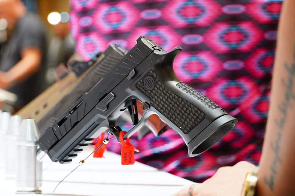 A Sig Sauer pistol on display at the 2024 NRA Annual Meeting