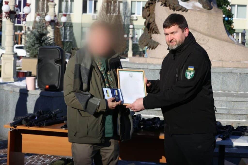 Mayor of Irpin handing over weapons to the military, January 2024