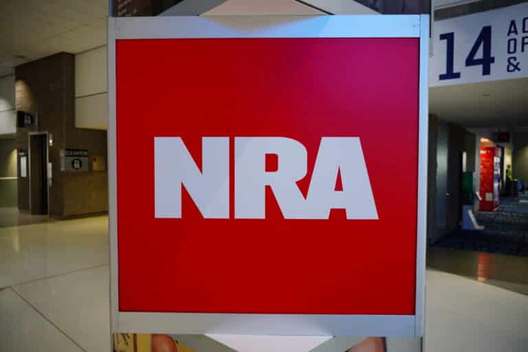 The National Rifle Association logo on display at the group's 2025 conference
