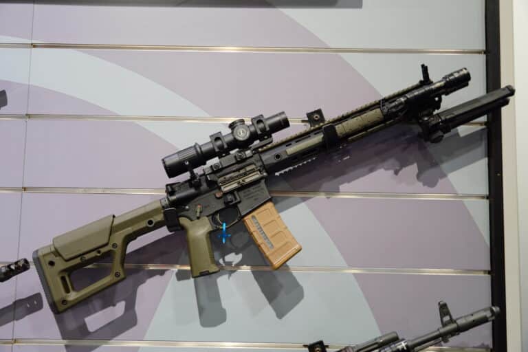 An AR-15 at a booth during the 2025 NRA Annual Meeting