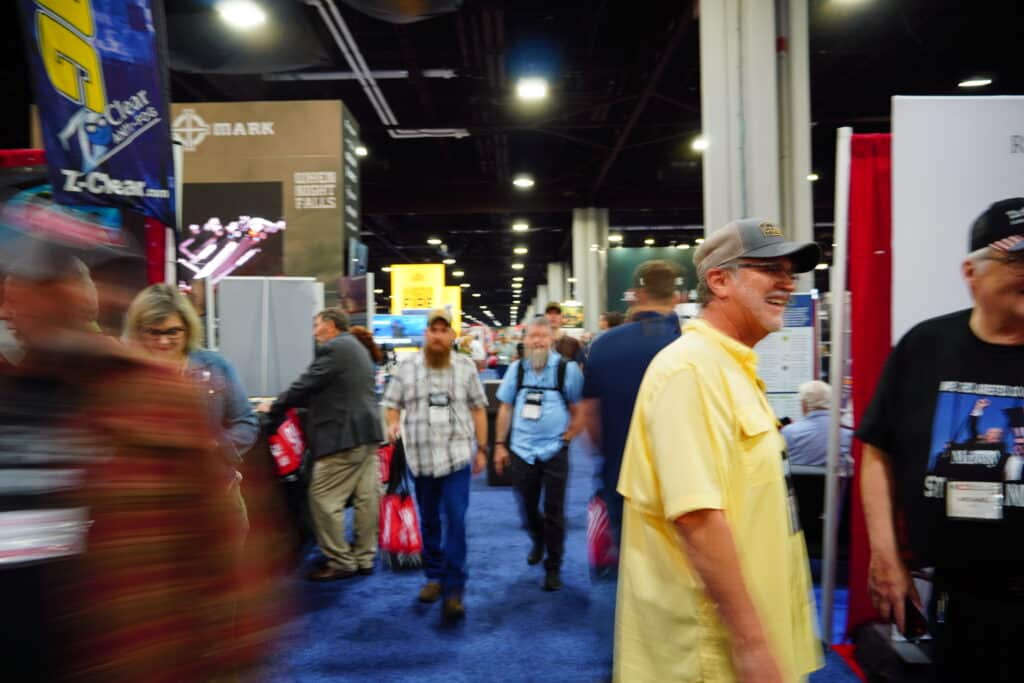 People explore the exhibit floor at the 2025 NRA Annual Meeting