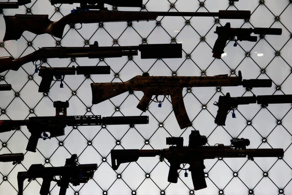 A collection of silenced firearms on display at the 2025 NRA Annual Meeting