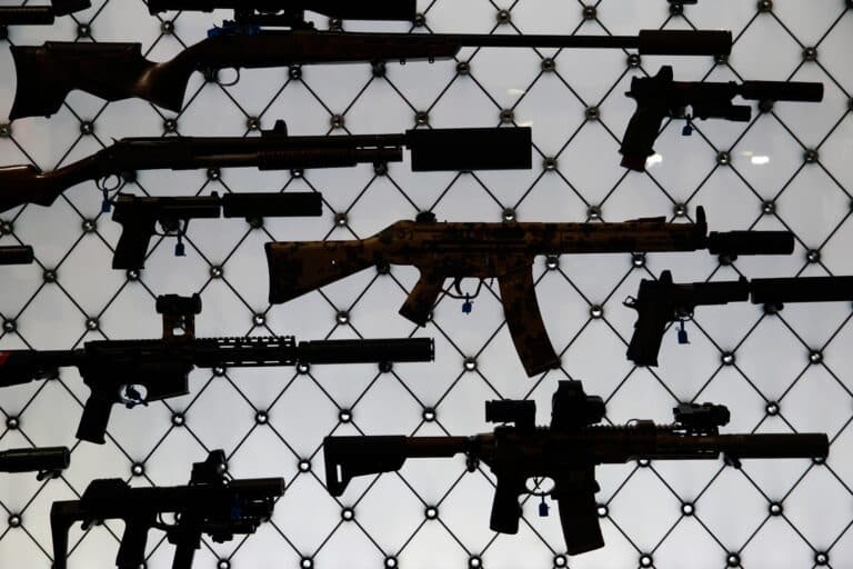 A collection of silenced firearms on display at the 2025 NRA Annual Meeting