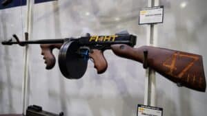 A firearm engraved with Donald Trump's face on display at the 2025 NRA Annual Meeting
