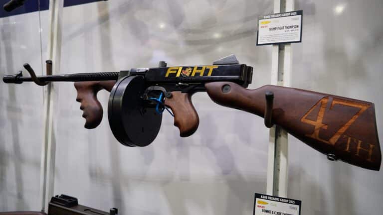 A firearm engraved with Donald Trump's face on display at the 2025 NRA Annual Meeting