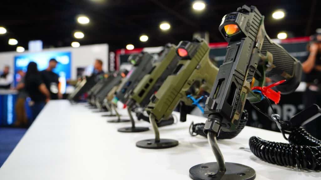 Pistols on display in the exhibit hall of the 2025 NRA Annual Meeting