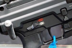 A firearm's safety selector switch on display at the 2025 NRA Annual Meeting